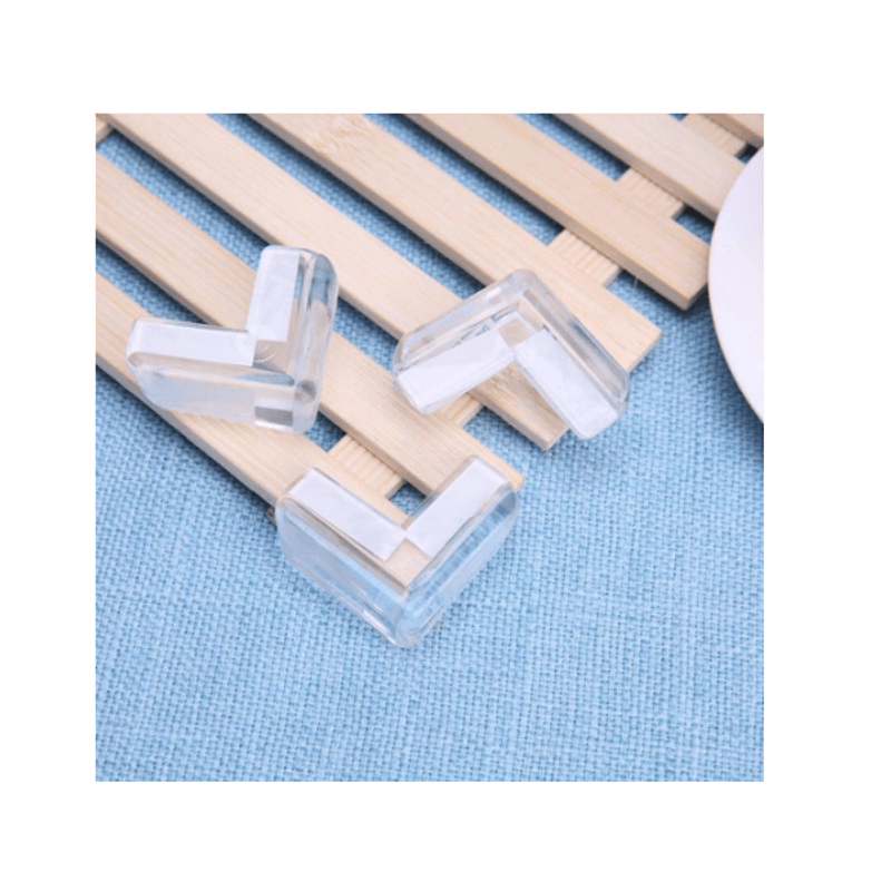 Casa si Gradina - Mobilier - Mobilier copii - Sisteme de siguranta - Set 10 Protectii Colturi din Silicon Forma L aplicabile cu Banda Dublu Adeziva 4 x 2 x 4 cm - Infinity.ro