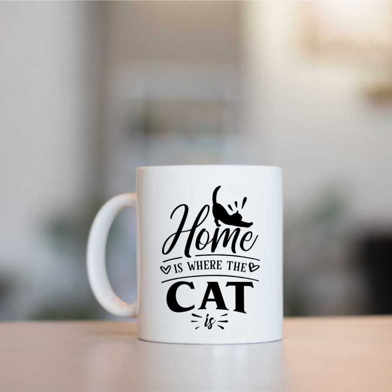 Casa si Gradina - Bucatarie si vesela - Cani si pahare - Cani si cesti - Cana cu mesaj "Home is where the cat is" - 300 ml - Infinity.ro