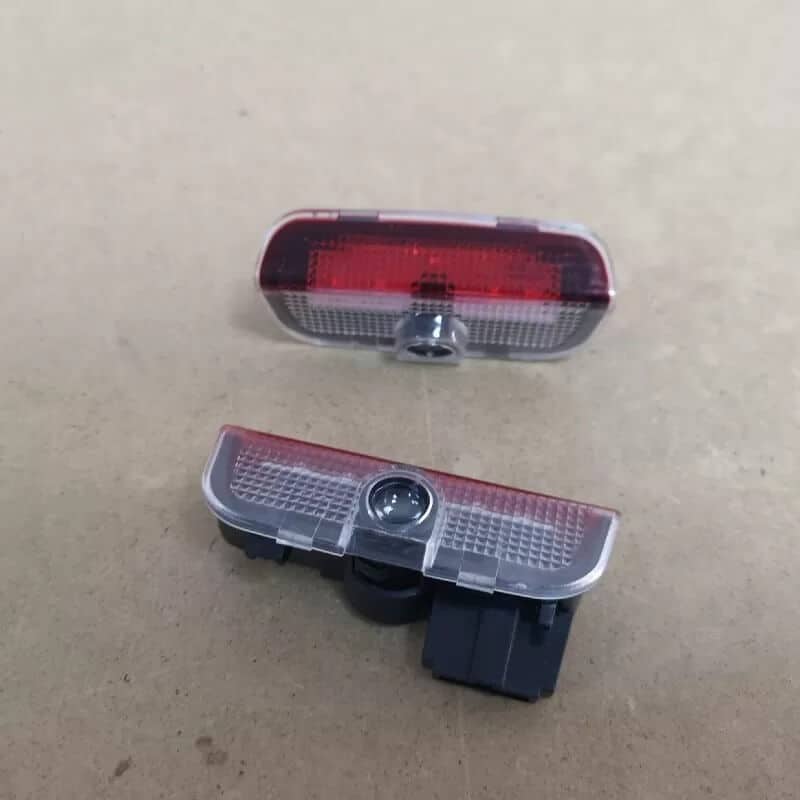 Auto si Moto - Piese auto si accesorii - Caroserie - Faruri, stopuri si proiectoare - Lampi logo portiere VW Passat B6, B7, CC, Golf 5, 6, 7, Touareg - Infinity.ro