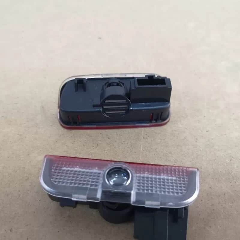 Auto si Moto - Piese auto si accesorii - Caroserie - Faruri, stopuri si proiectoare - Lampi logo portiere VW Passat B6, B7, CC, Golf 5, 6, 7, Touareg - Infinity.ro