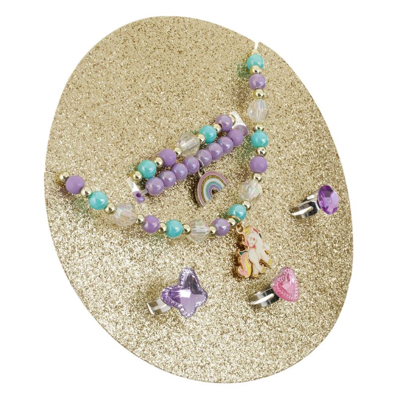 Fashion, accesorii si bijuterii - Copii - Accesorii copii - Bijuterii si ceasuri copii - Set bijuterii unicorn, 6 piese, geanta transparenta multicolor, diametru 13.5 cm, inaltime 4 cm - Infinity.ro