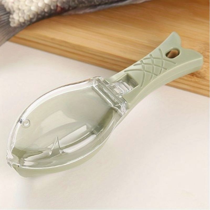 Casa si Gradina - Bucatarie si vesela - Ustensile bucatarie - Razatori si curatatoare - Curatator Manual Solzi de Peste, Flippy, Forma Peste , Recipient cu Capcac pentru Solzi, Plastic, Verde deschis, 16x6 cm - Infinity.ro
