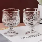 Casa si Gradina - Bucatarie si vesela - Cani si pahare - Pahare - Set 6 Pahare din Sticla cu Picior Decorativ – Model Vintage Elegant in Relief, 150ml, Ideal pentru Lichior si Aperitive - Infinity.ro