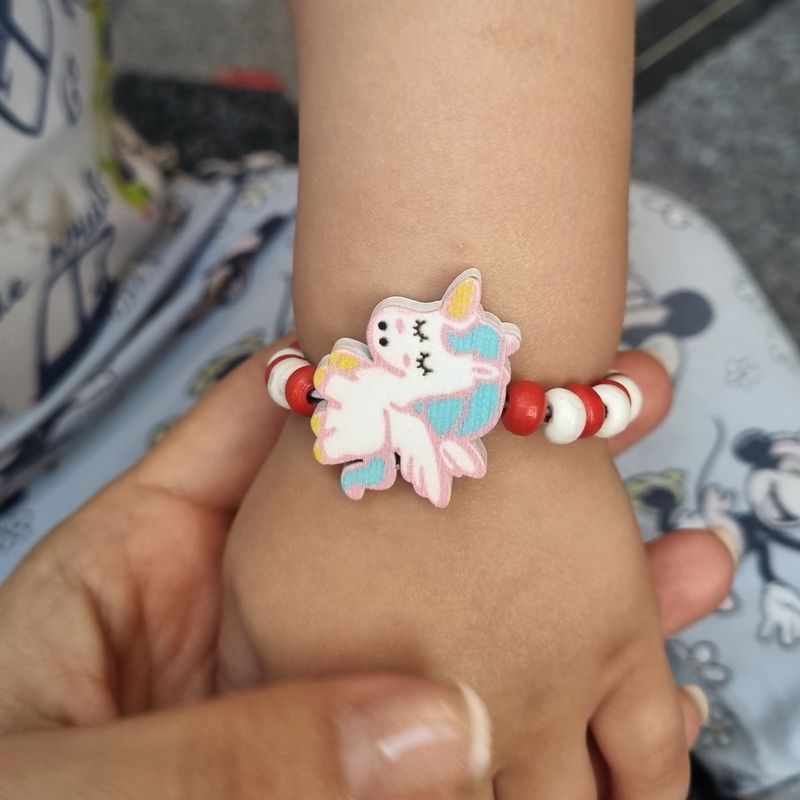 Market - Cadouri - Martisoare - Bratara copii elastica, cu charm unicorn zburator si margelute din lemn, model 1 - Infinity.ro