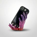 PC, gaming si accesorii - Gaming - Accesorii gaming - Accesorii console gaming - Suport Consola Portabila, design Silueta de Mana, Mov, 23 cm - Infinity.ro