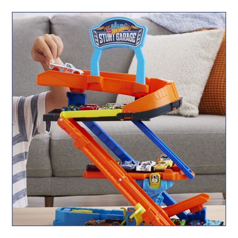 Jucarii, Copii si Bebe - Jucarii si jocuri - Vehicule si jucarii cu telecomanda - Masinute - HOT WHEELS CITY TRANSFORMAREA GARAJULUI DE CASCADORII CU MASINUTA INCLUSA - Infinity.ro