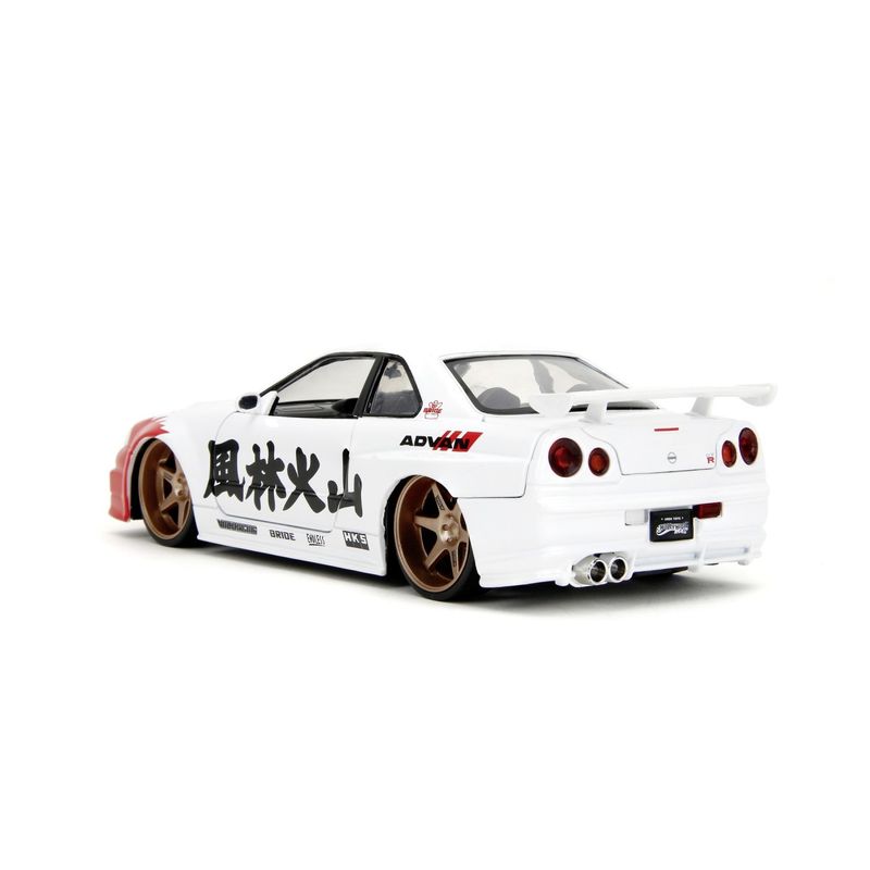 Jucarii, Copii si Bebe - Jucarii si jocuri - Vehicule si jucarii cu telecomanda - Masinute - JADA SET FIGURINA METALICA 6CM SI MASINUTA NISSAN SKYLINE GTR SCARA 1 LA 24 - Infinity.ro