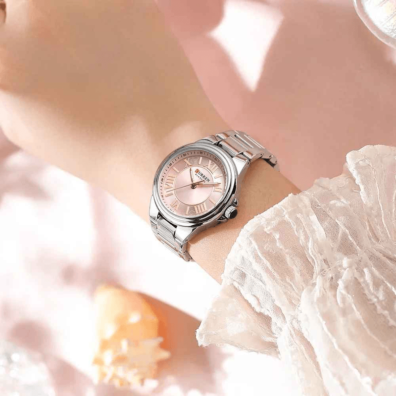 Fashion, accesorii si bijuterii - Femei - Bijuterii femei - Ceasuri femei - Ceas dama Curren C9061L argintiu cu cadran roz, cifre romane si bratara din otel inoxidabil - Infinity.ro