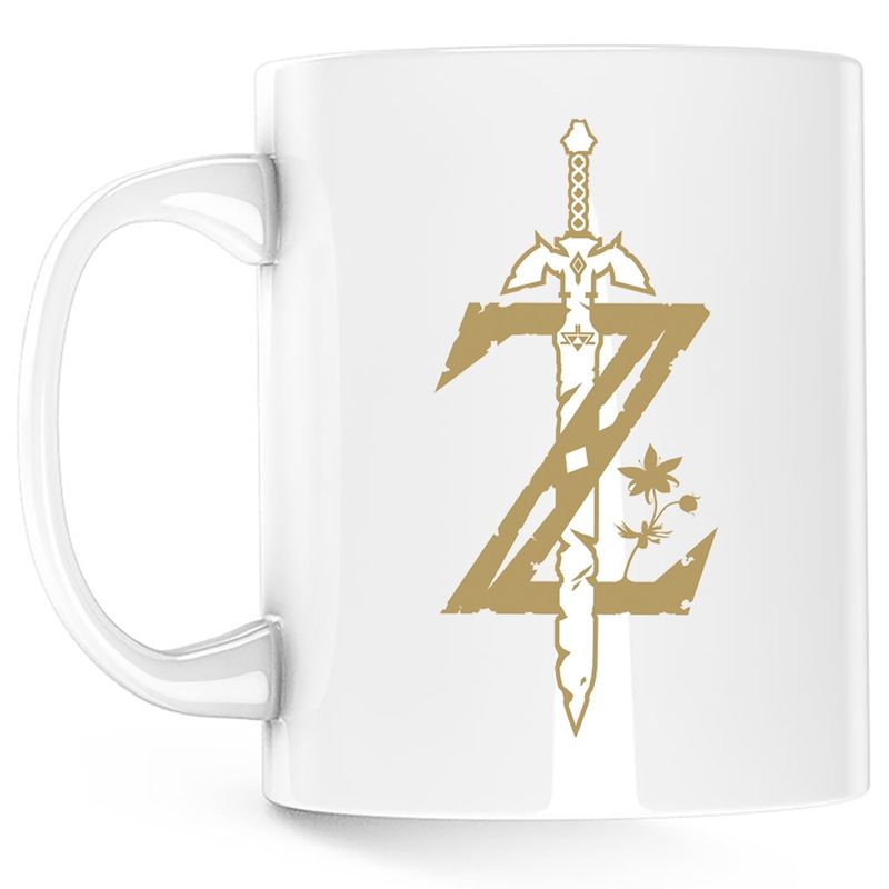 Casa si Gradina - Bucatarie si vesela - Cani si pahare - Cani si cesti - Cana Legend of Zelda Game Logo Sky, alba, 330 ml - Infinity.ro