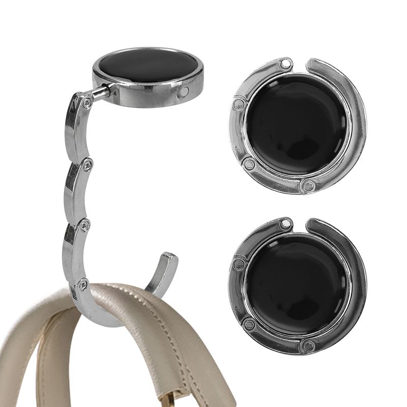 Fashion, accesorii si bijuterii - Femei - Accesorii femei - Alte accesorii femei - Set 2 carlige de masa pentru geanta Kwmobile, inchidere magnetica, pliabile, anti-alunecare, metal, argintiu, gri - Infinity.ro