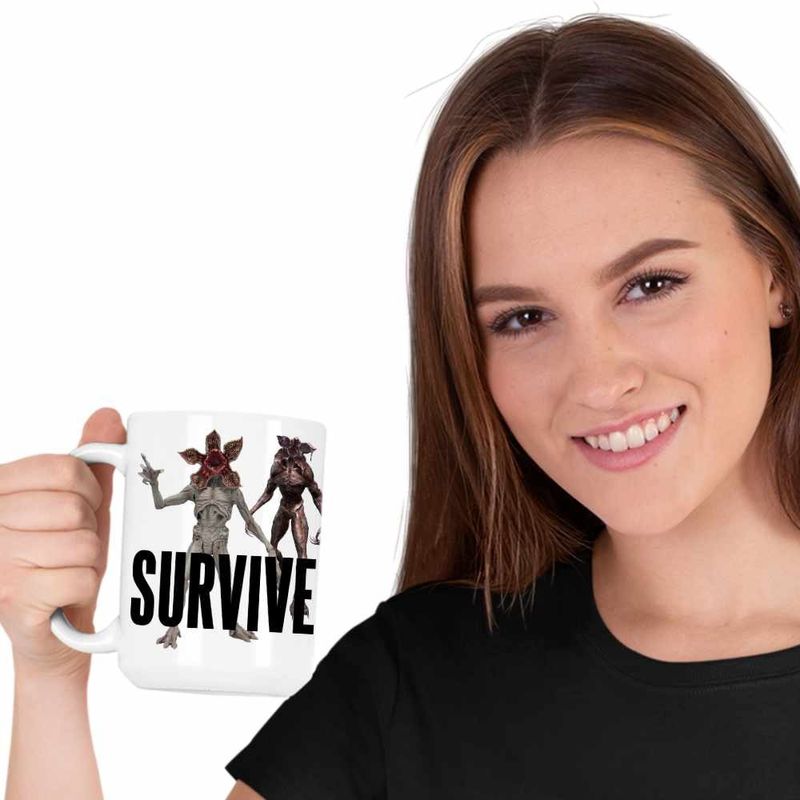 Casa si Gradina - Bucatarie si vesela - Cani si pahare - Cani si cesti - Cana Lewis Capaldi Survive, alba, 330ml - Infinity.ro