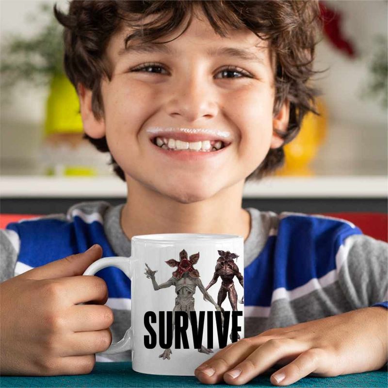 Casa si Gradina - Bucatarie si vesela - Cani si pahare - Cani si cesti - Cana Lewis Capaldi Survive, alba, 330ml - Infinity.ro