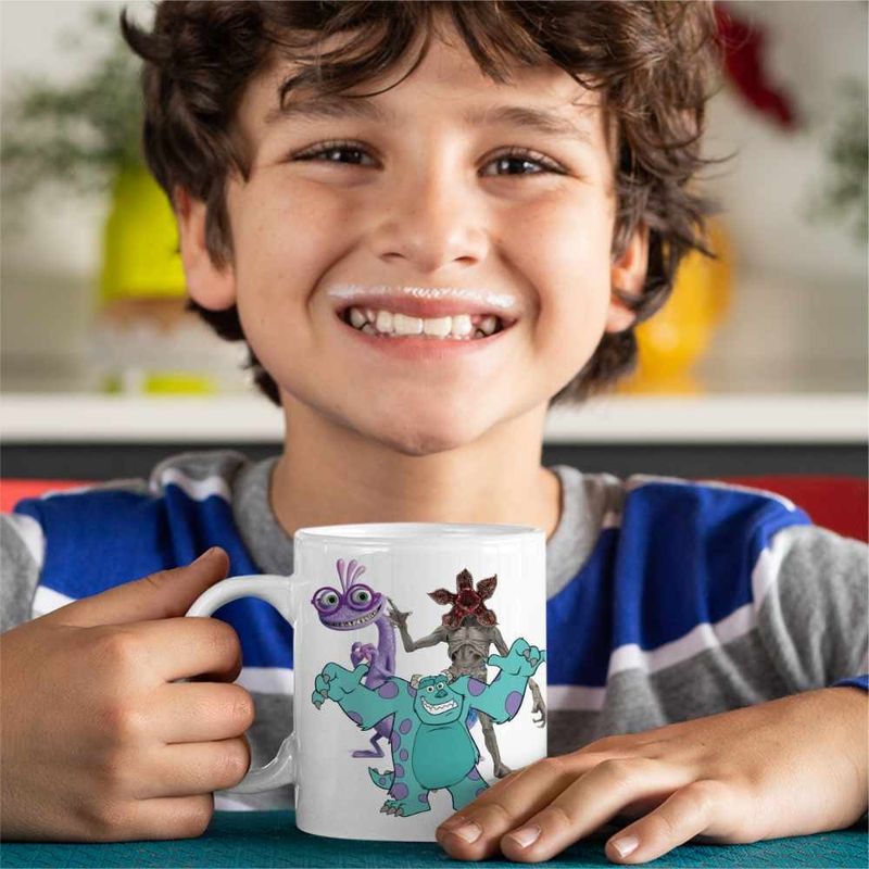 Casa si Gradina - Bucatarie si vesela - Cani si pahare - Cani si cesti - Cana James Monsters University, alba, 330ml - Infinity.ro