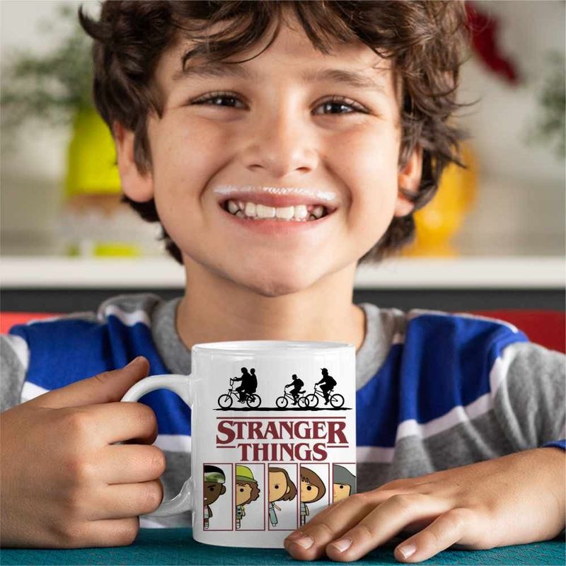 Casa si Gradina - Bucatarie si vesela - Cani si pahare - Cani si cesti - Cana Stranger Things Team Survivor Film CoolTrend, alba, 330ml - Infinity.ro