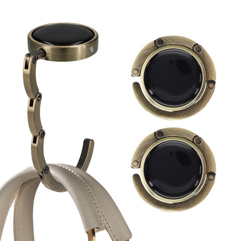 Casa si Gradina - Mobilier - Feronerie si accesorii mobila - Set 2 carlige de masa pentru geanta Kwmobile, inchidere magnetica, pliabile, anti-alunecare, metal, bronz - Infinity.ro